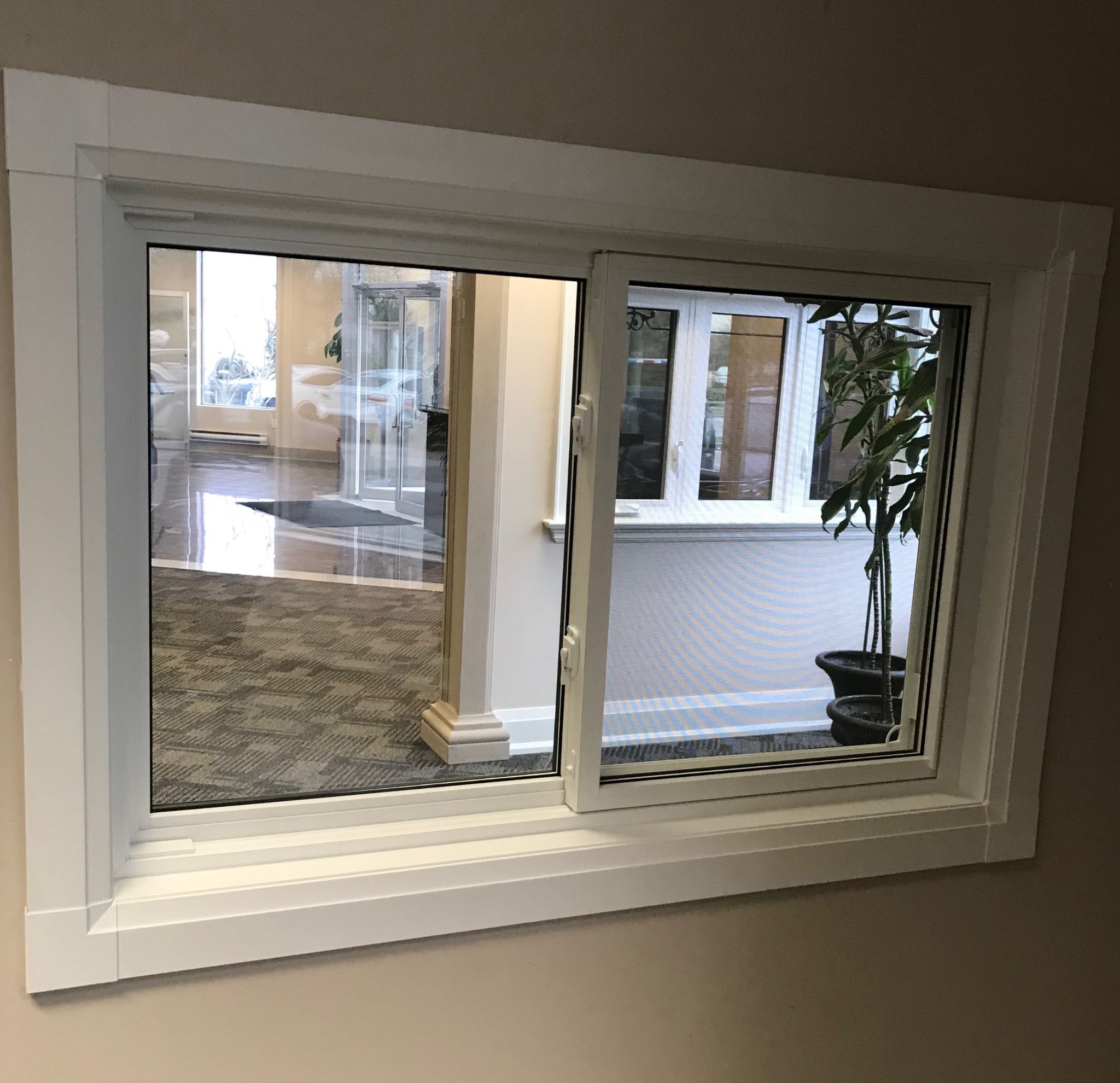 Horizontal vinyl sliding window with modern design, energy-efficient frame, Toronto Canada home exterior.