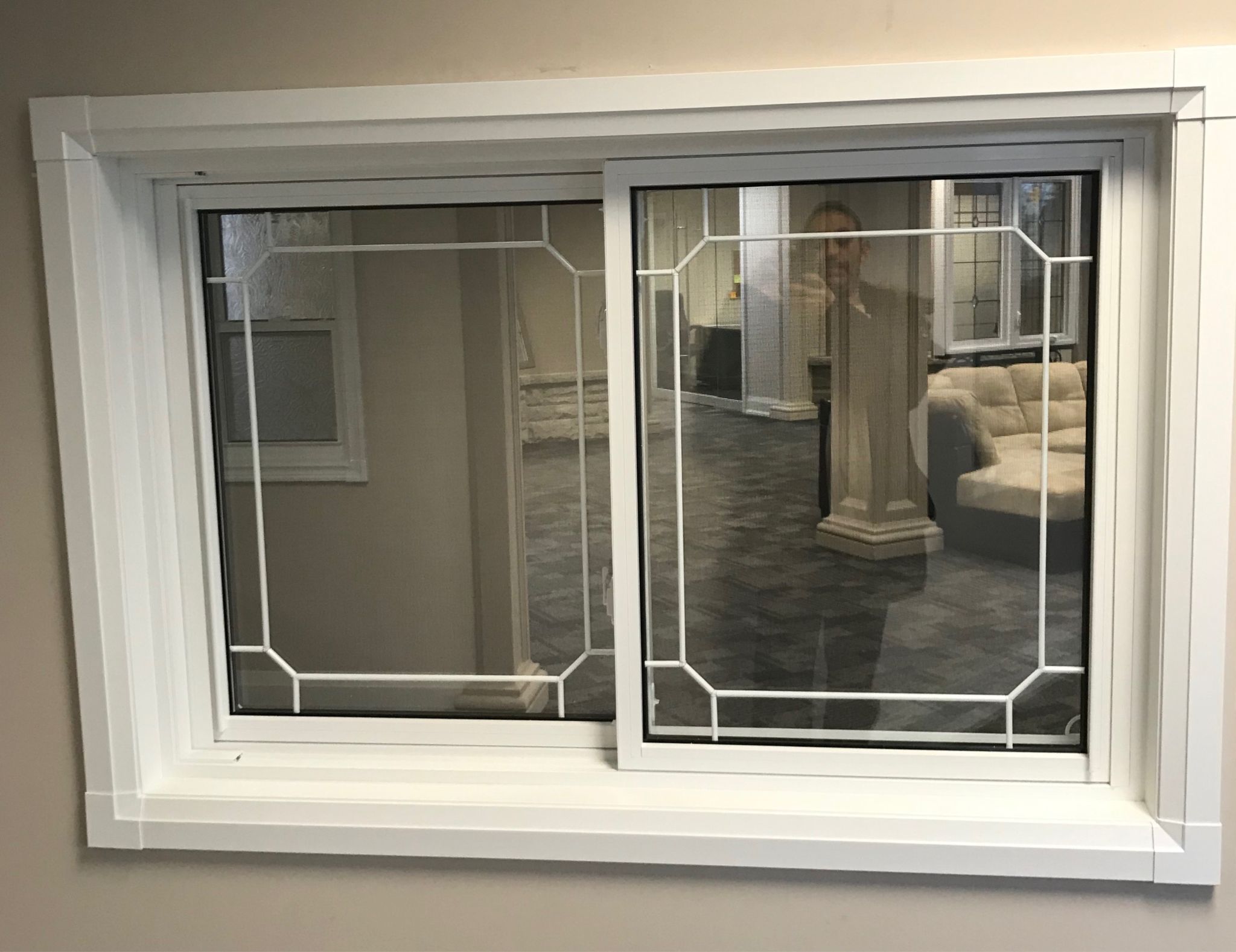 Horizontal vinyl sliding window with modern design, energy-efficient frame, Toronto Canada home exterior.