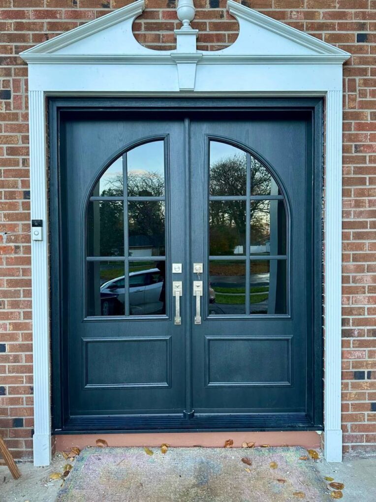 After Custom Matte-Black Fiberglass Double Doors With Arched Glass