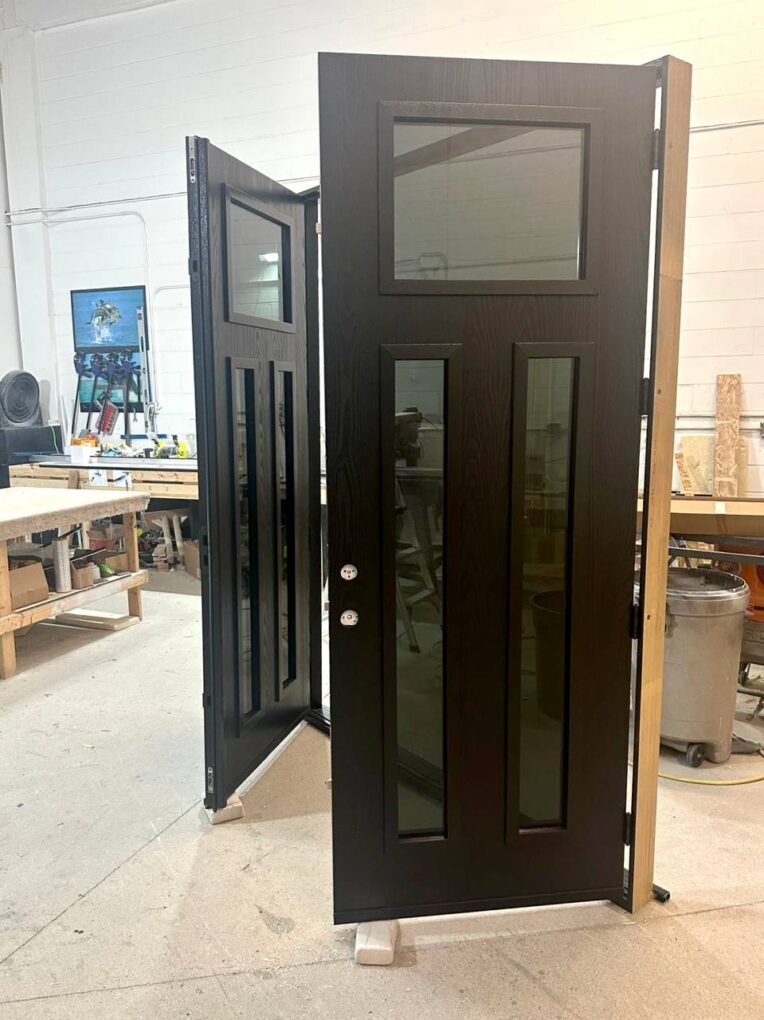 Dark woodgrain 8 ft fiberglass double entry doors with modern lock preparation and custom glass layout.