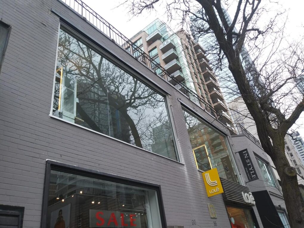 Frameless 12 mm glass storefront windows for a retail space in Yorkville, Toronto