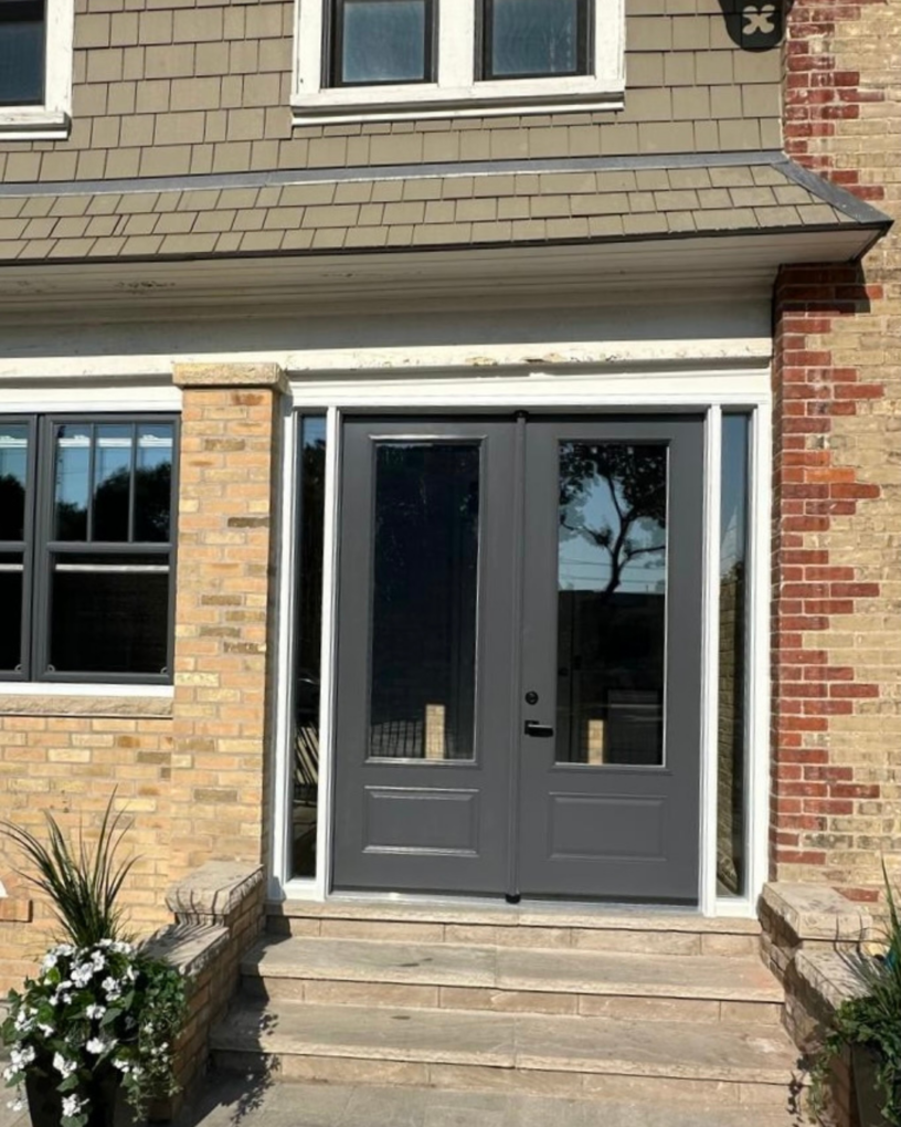 Updated entry door on a Toronto heritage home with sidelites