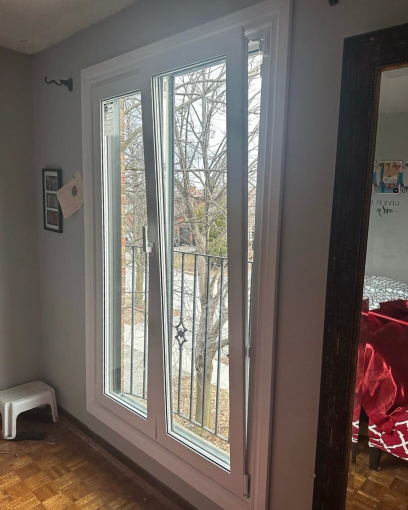 Interior view of new tilt and turn doors in a Maple home bringing more light into the room and opening to the yard.