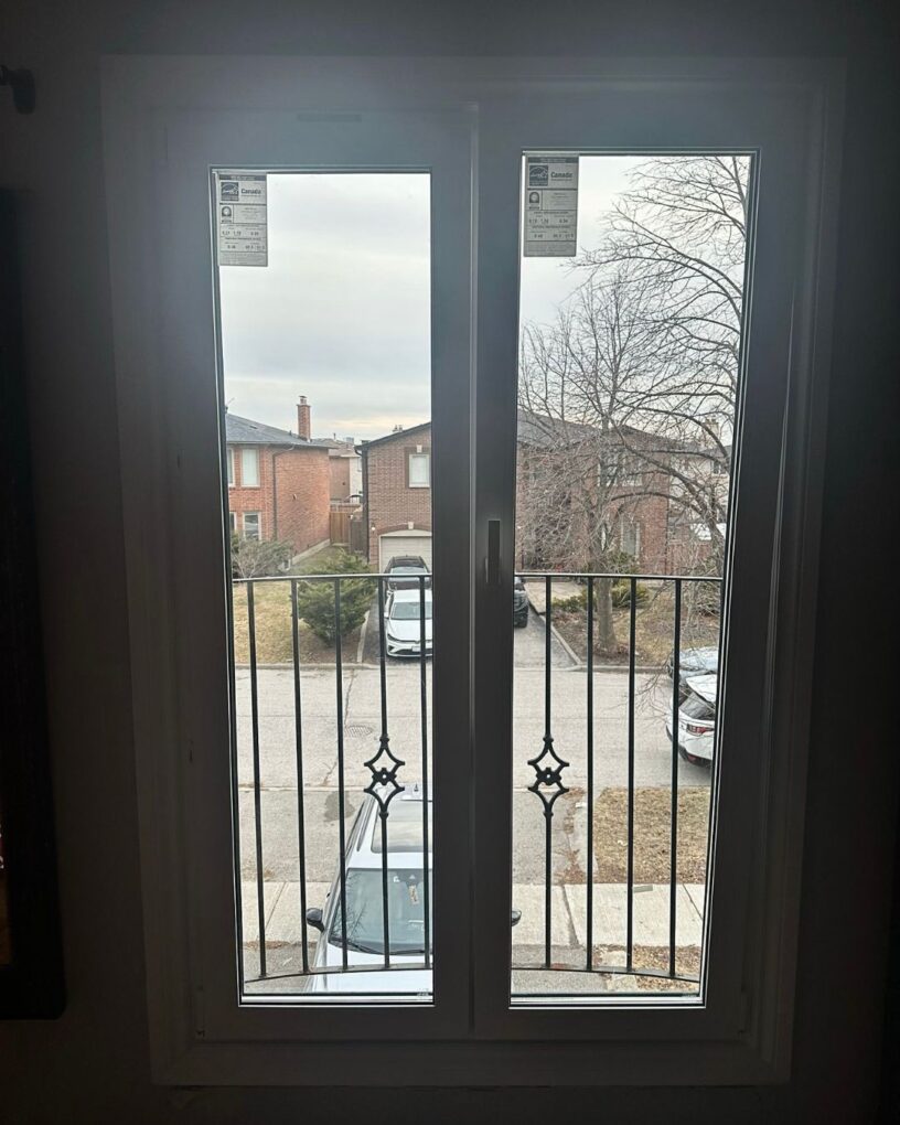 Modern European tilt and turn door system installed in Maple with large glass panels and a clean patio opening.