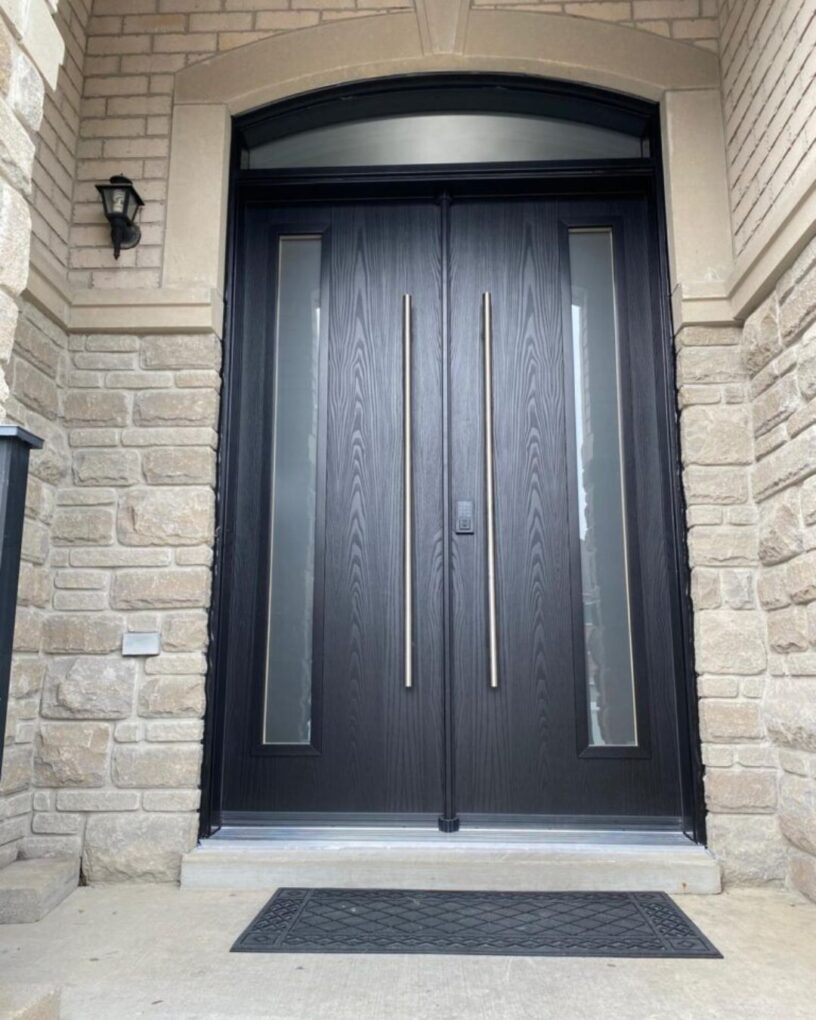 Contemporary black fiberglass entry door with oversized pull handles