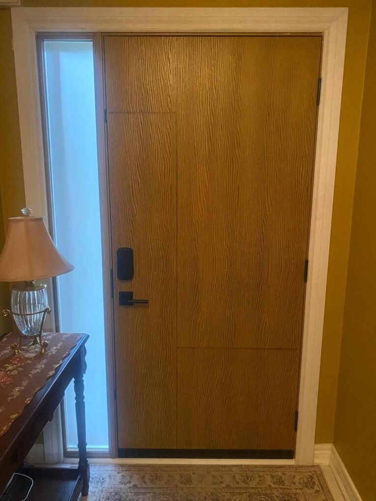 Wood grain fiberglass entry door with sidelight and multi-point lock