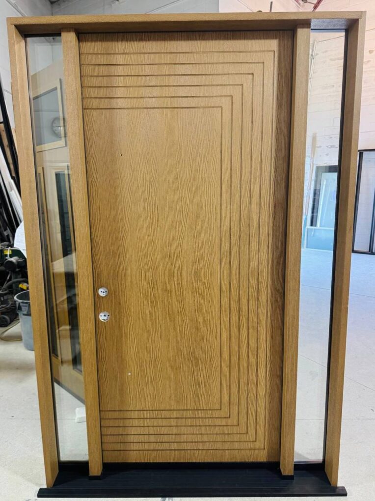 Fiberglass wood look front door with sidelights and geometric grooving